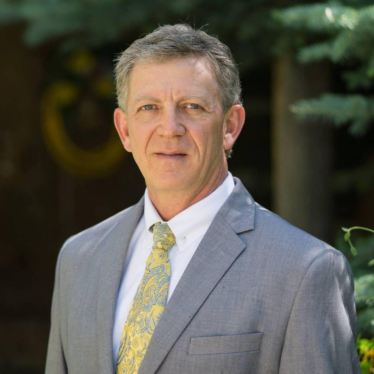 Person developing a website on a laptop